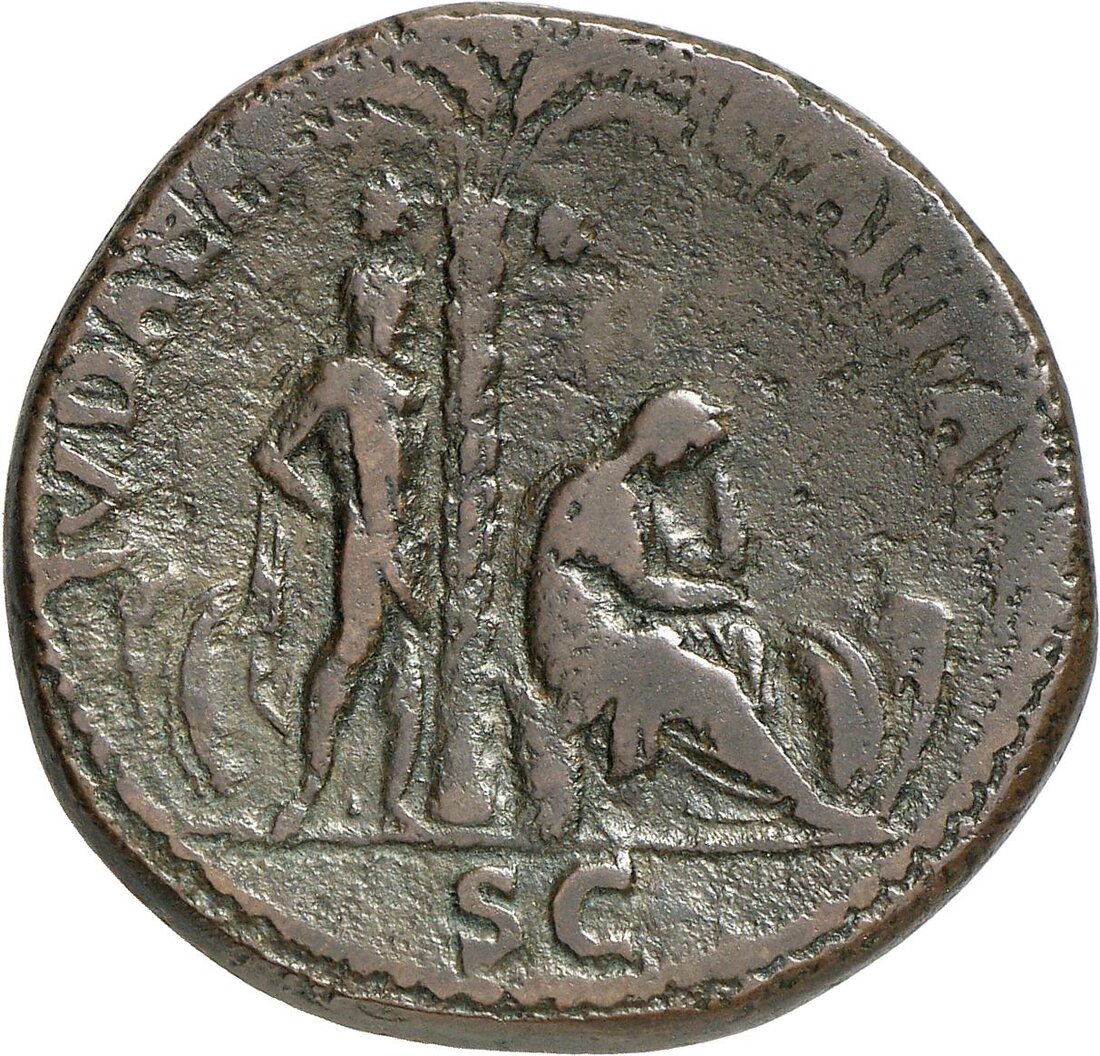 Reverse of a Vespasian IVDAEA CAPTA sestertius — palm tree with a bound captive standing left and the mourning figure of Judaea seated right, SC in the exergue