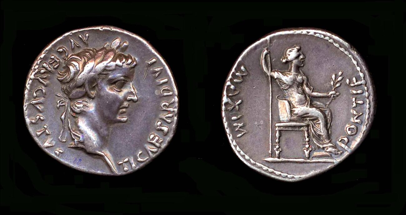 Silver denarius of Tiberius with laureate portrait and a seated PONTIF MAXIM reverse figure